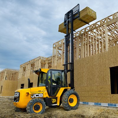 Forklift unloading machinery and industrial equipment in Reigate